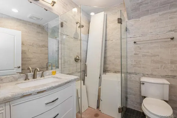 a view of empty room with fireplace and window