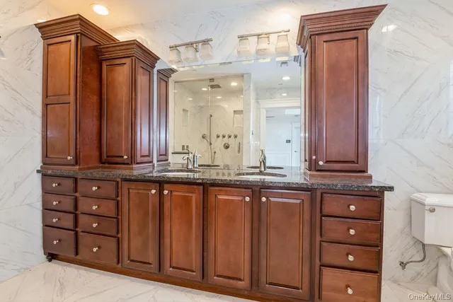 a view of walk in closet with clothes