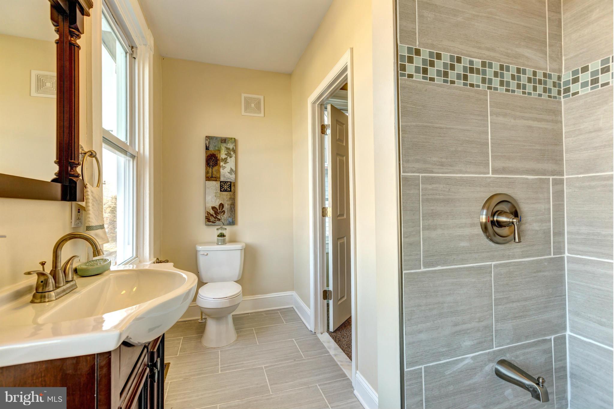 5503 Morello Road Baltimore, MD 21214 - Photo 21 of 30 a bathroom with a sink and a mirror