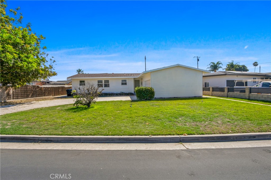 12262 Morrie Lane Garden Grove, CA 92840 - Photo 1 of 16 a view of a back yard of the house with green space
