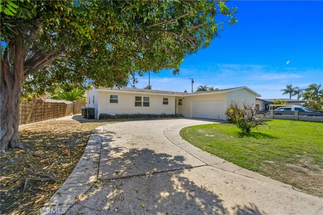 a house view with a garden space