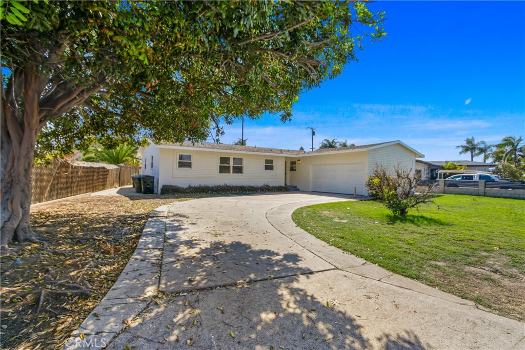 12262 Morrie Lane Garden Grove, CA 92840 - Photo 16 of 16 a house view with a garden space