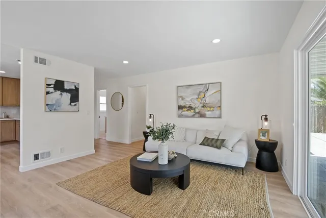 a living room with furniture and window