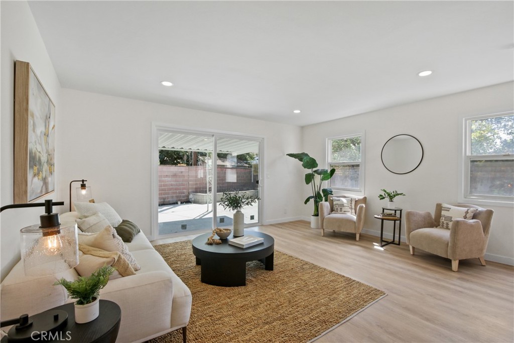 12262 Morrie Lane Garden Grove, CA 92840 - Photo 6 of 16 a living room with furniture and wooden floor