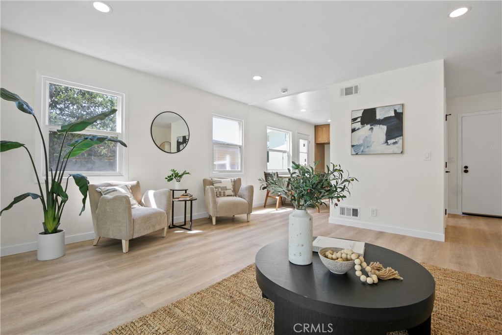 12262 Morrie Lane Garden Grove, CA 92840 - Photo 7 of 16 a living room with furniture potted plant and a fireplace