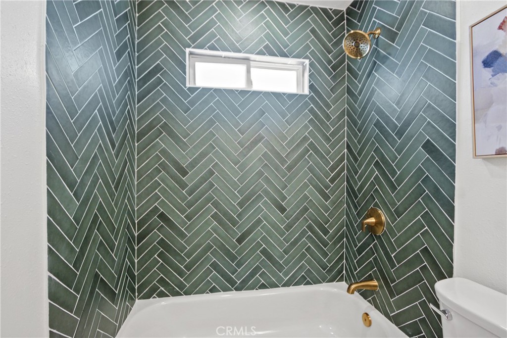 12262 Morrie Lane Garden Grove, CA 92840 - Photo 9 of 16 a bathroom with a sink and a vanity