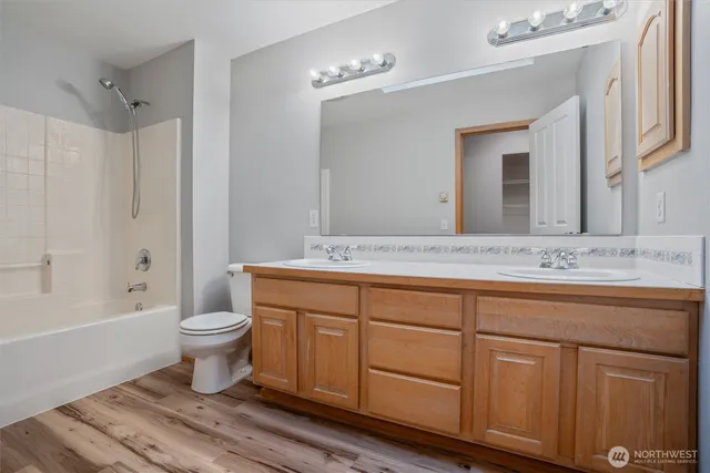a bathroom with a sink a toilet and bathtub