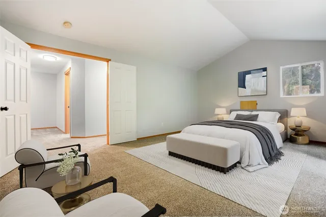 a bedroom with bed and a chair