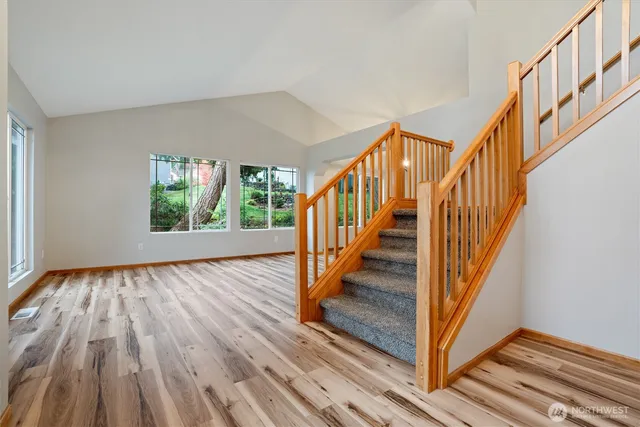 a view of an entryway with wooden floor