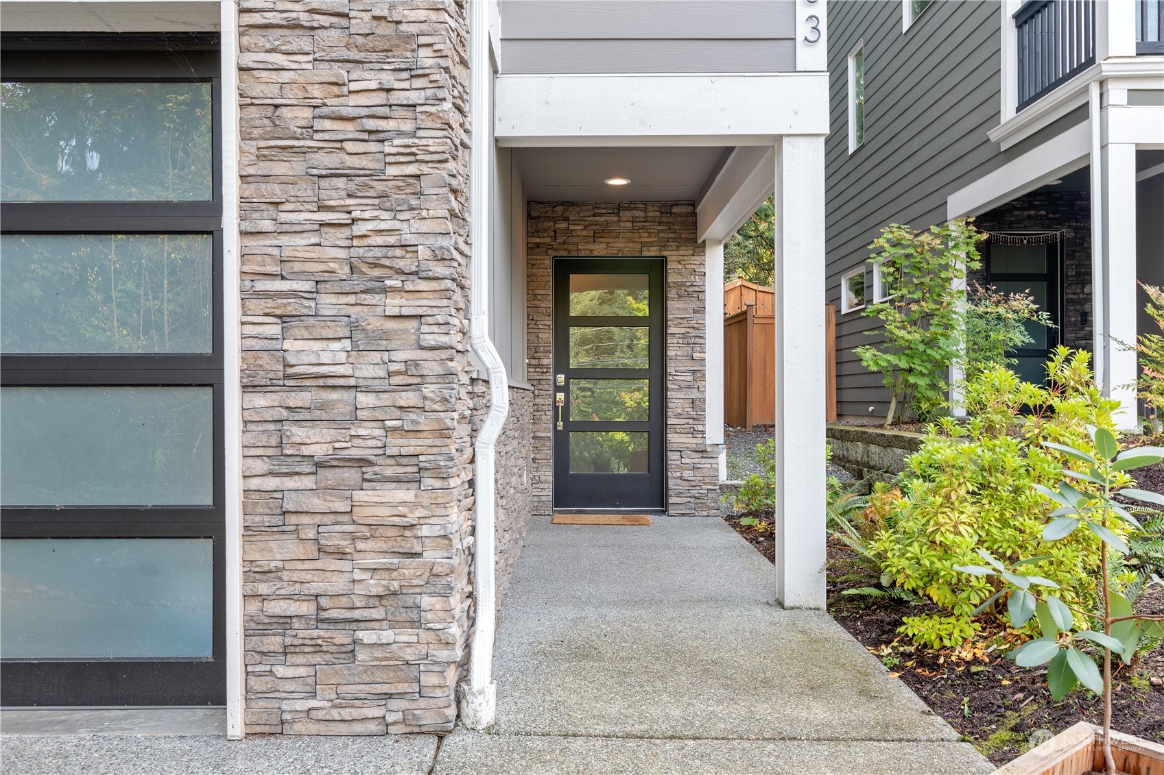 22803 23rd Avenue Southeast Bothell, WA 98021 - Photo 3 of 40 a view of front door of house with potted plant