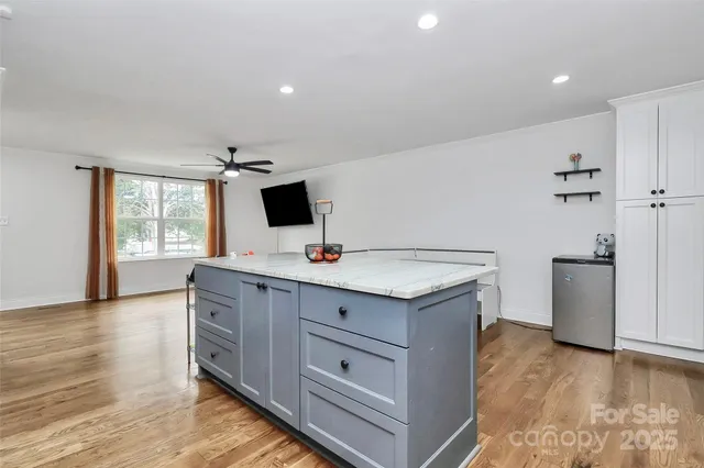 a kitchen that has a sink and a stove in it