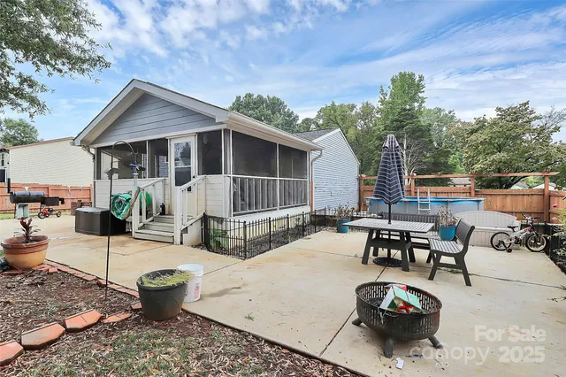 a view of a backyard with sitting area