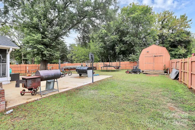 a view of a backyard with sitting area
