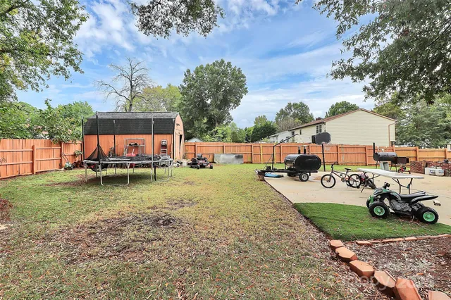 a view of a patio with a table chairs and a table