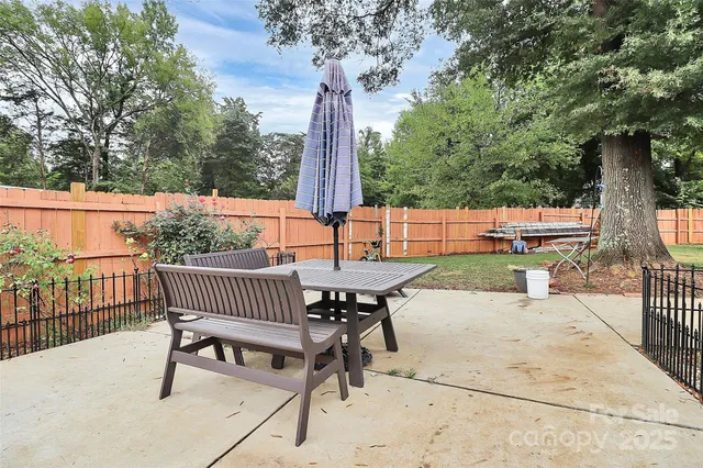 a house view with swimming pool and sitting space
