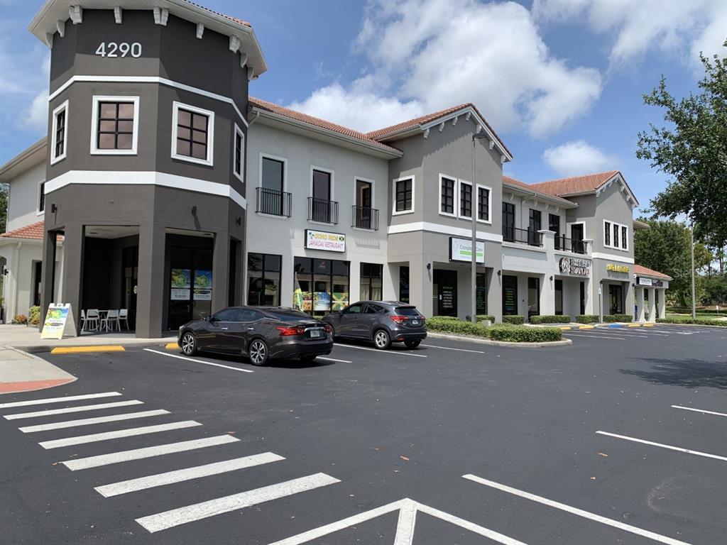 4290 South Highway 27, Unit 201 / 1 & 5 Clermont, FL 34711 - Photo 1 of 32 a view of a street that has couple of cars parked on the road