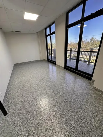 a kitchen with stainless steel appliances a white stove top oven and a refrigerator
