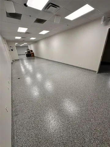 a view of an empty room with windows