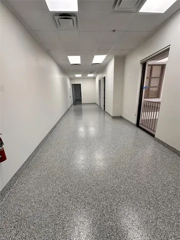 a view of an empty room with a window