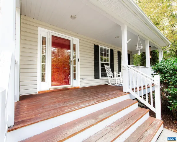 a view of a house with wooden floor and floor to ceiling windows