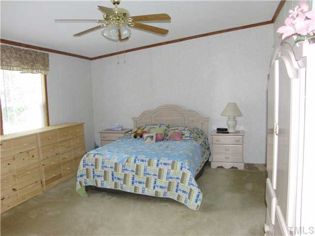 1224 Roffler Street Garner, NC 27529 - Photo 6 of 14 Master Bedroom has vaulted ceiling, large private bath & a spacious walk in closet.