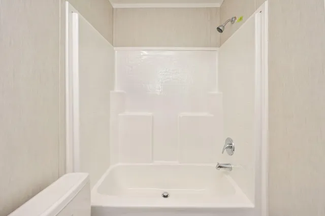 a bathroom with a white bath tub