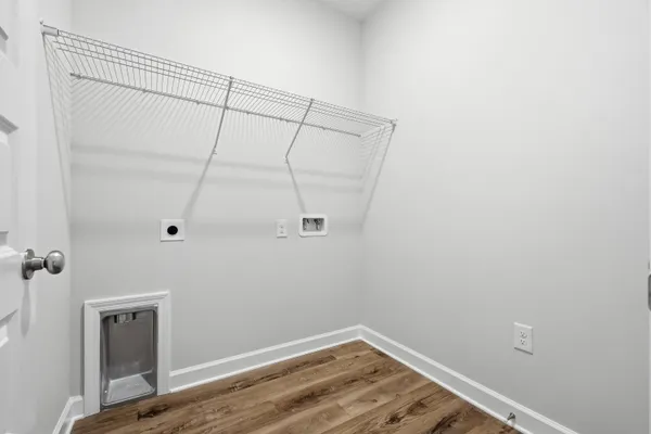 a view of a room with wooden floor and closet