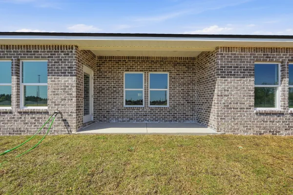 a view of front door of house with outdoor space