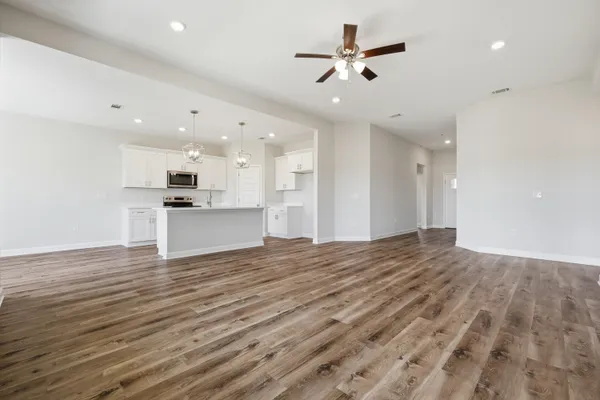 a view of a kitchen with a sink and a stove top oven