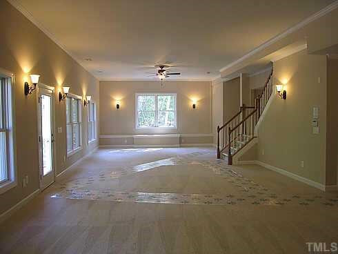 7409 Chesley Lane Durham, NC 27713 - Photo 9 of 10 a view of an empty room with stairs and ventilation
