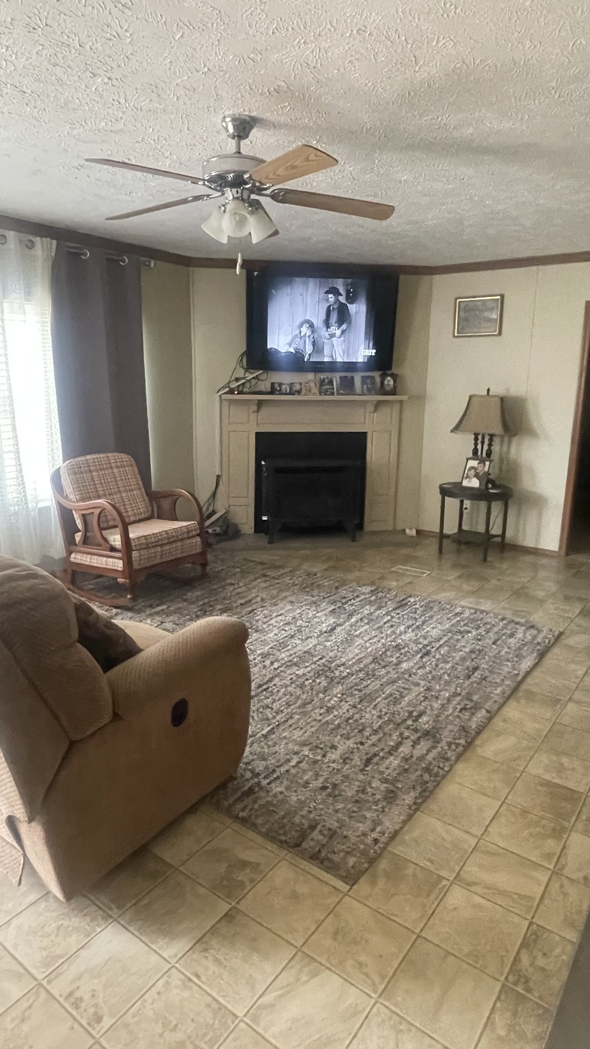 75 Snell Road Ethridge, TN 38456 - Photo 10 of 51 a living room with furniture and a fireplace
