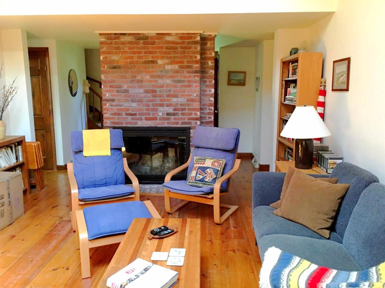 35 Split Rail Road Eastham, MA 02642 - Photo 12 of 28 a living room with furniture and a fireplace