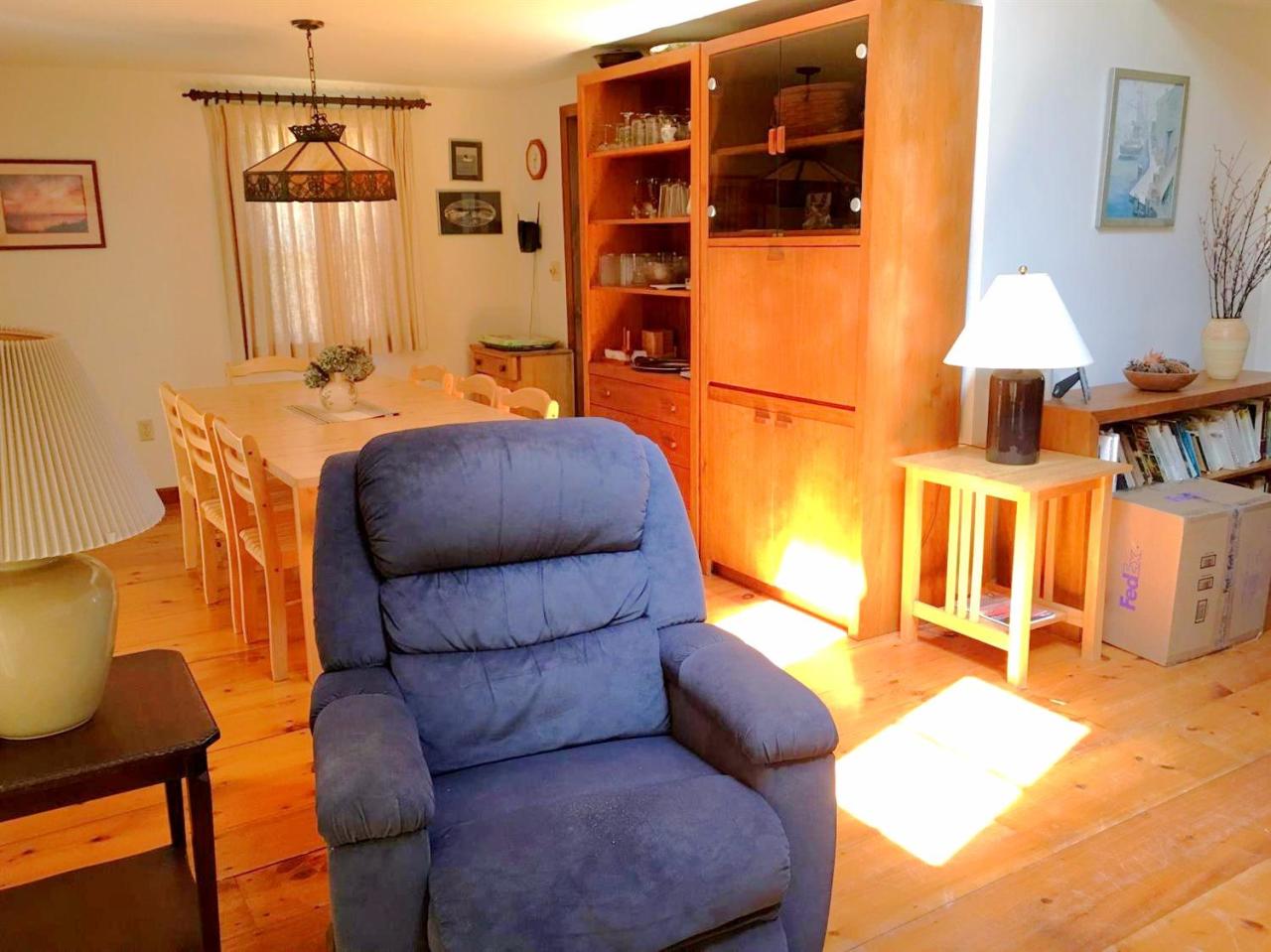 35 Split Rail Road Eastham, MA 02642 - Photo 14 of 28 a living room with furniture a flat screen tv and a lamp