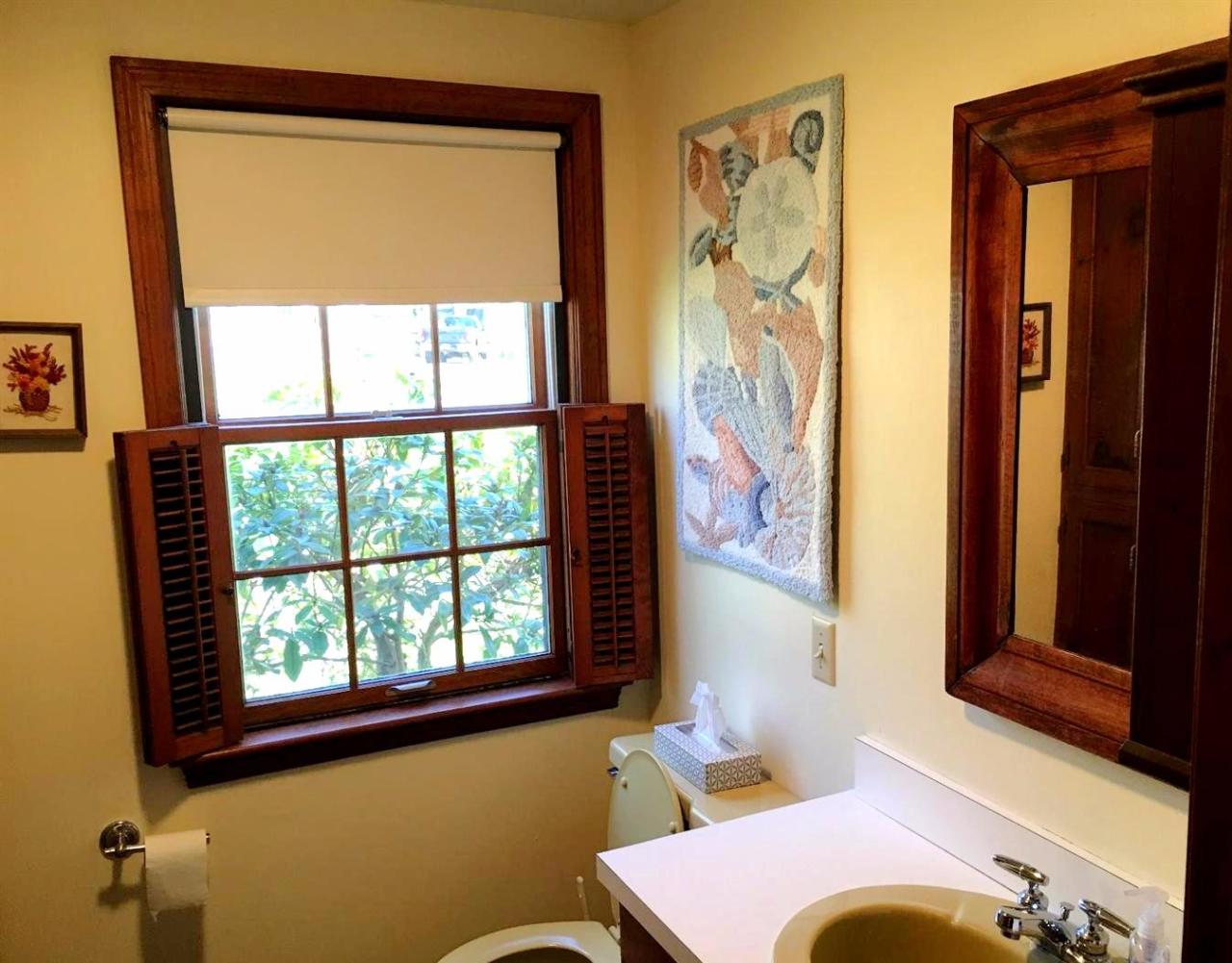35 Split Rail Road Eastham, MA 02642 - Photo 15 of 28 a bathroom with a window and a mirror