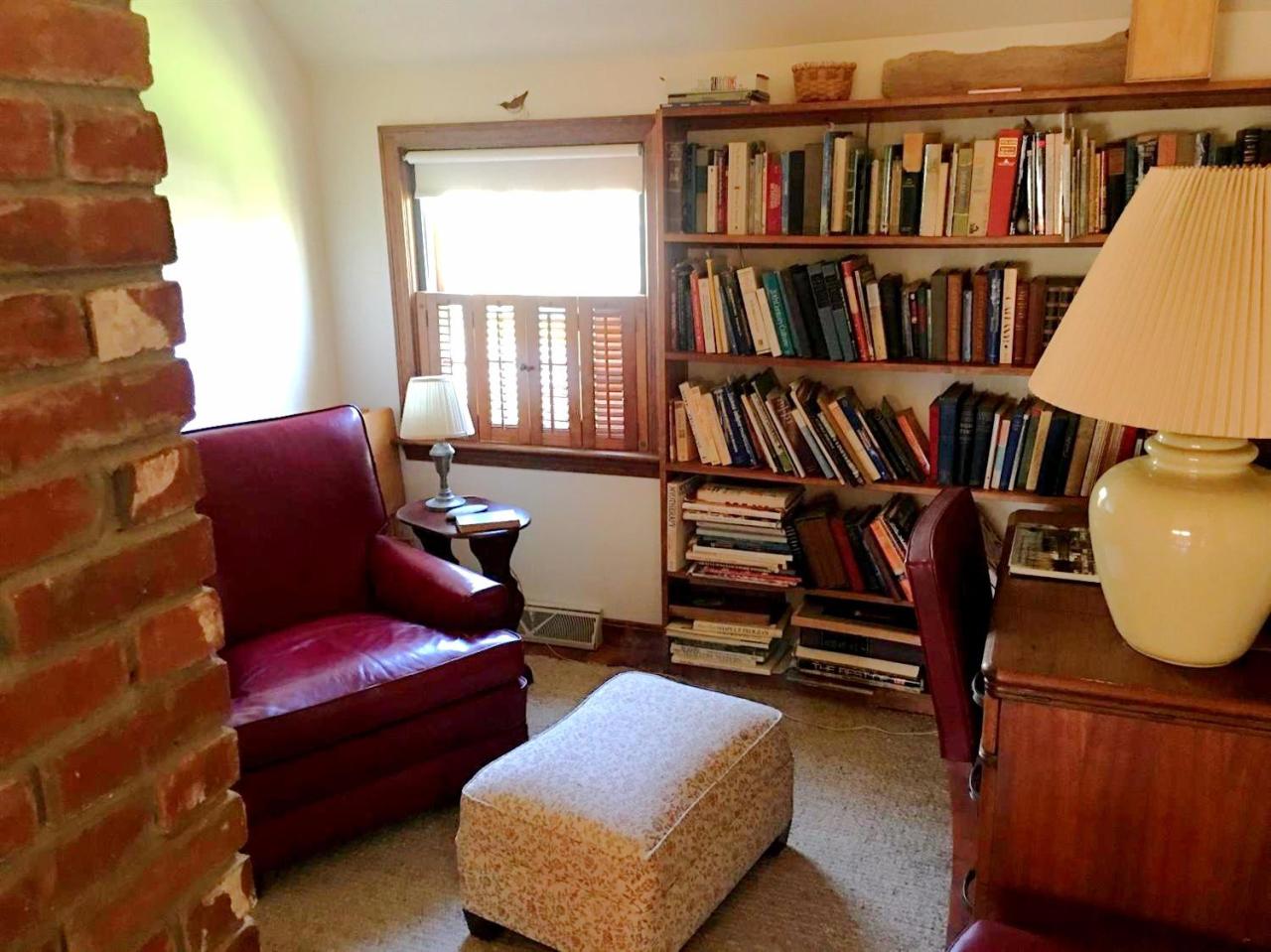 35 Split Rail Road Eastham, MA 02642 - Photo 18 of 28 a living room with furniture and a book shelf