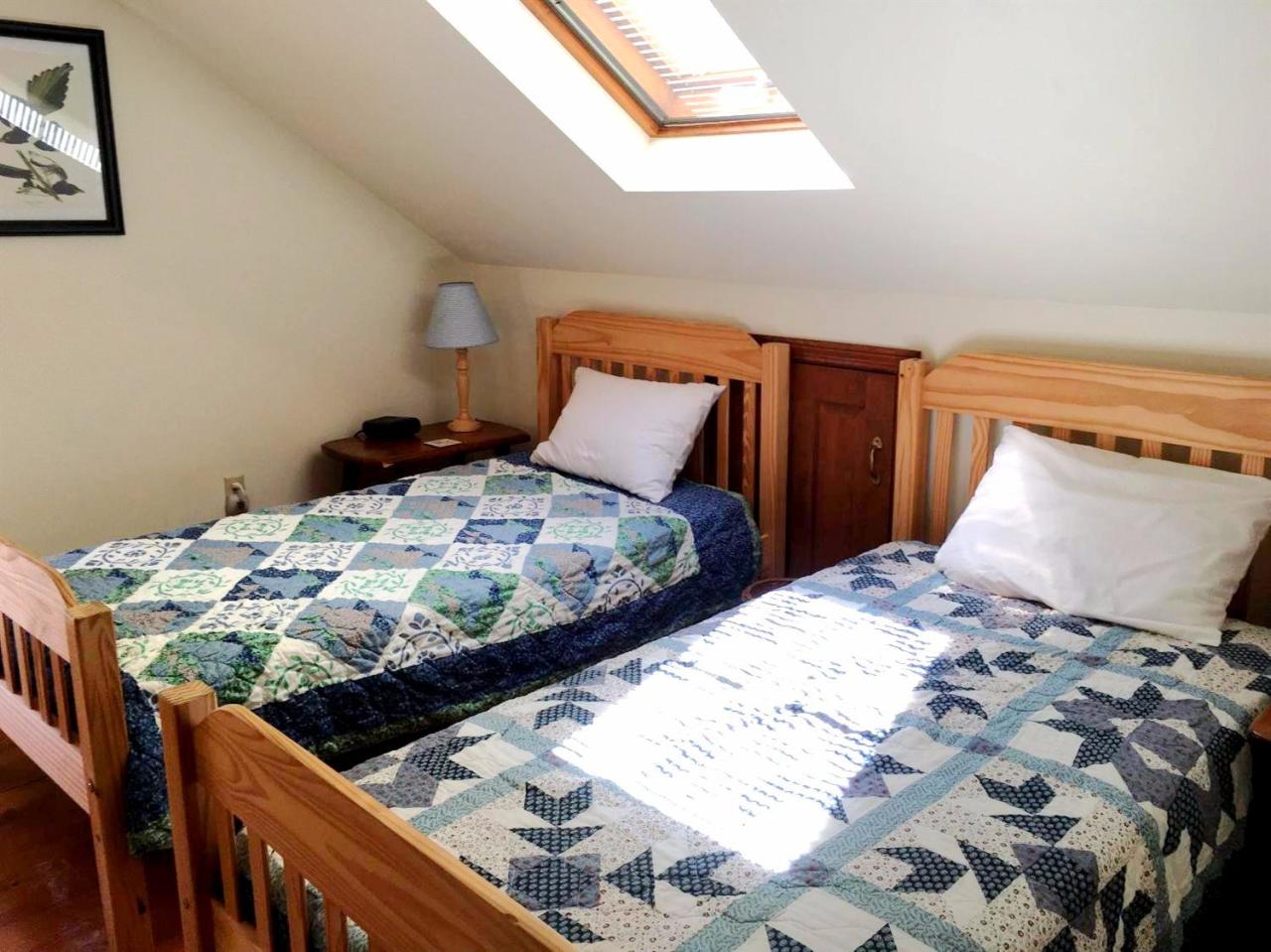 35 Split Rail Road Eastham, MA 02642 - Photo 20 of 28 a bed sitting in a bedroom and dressers