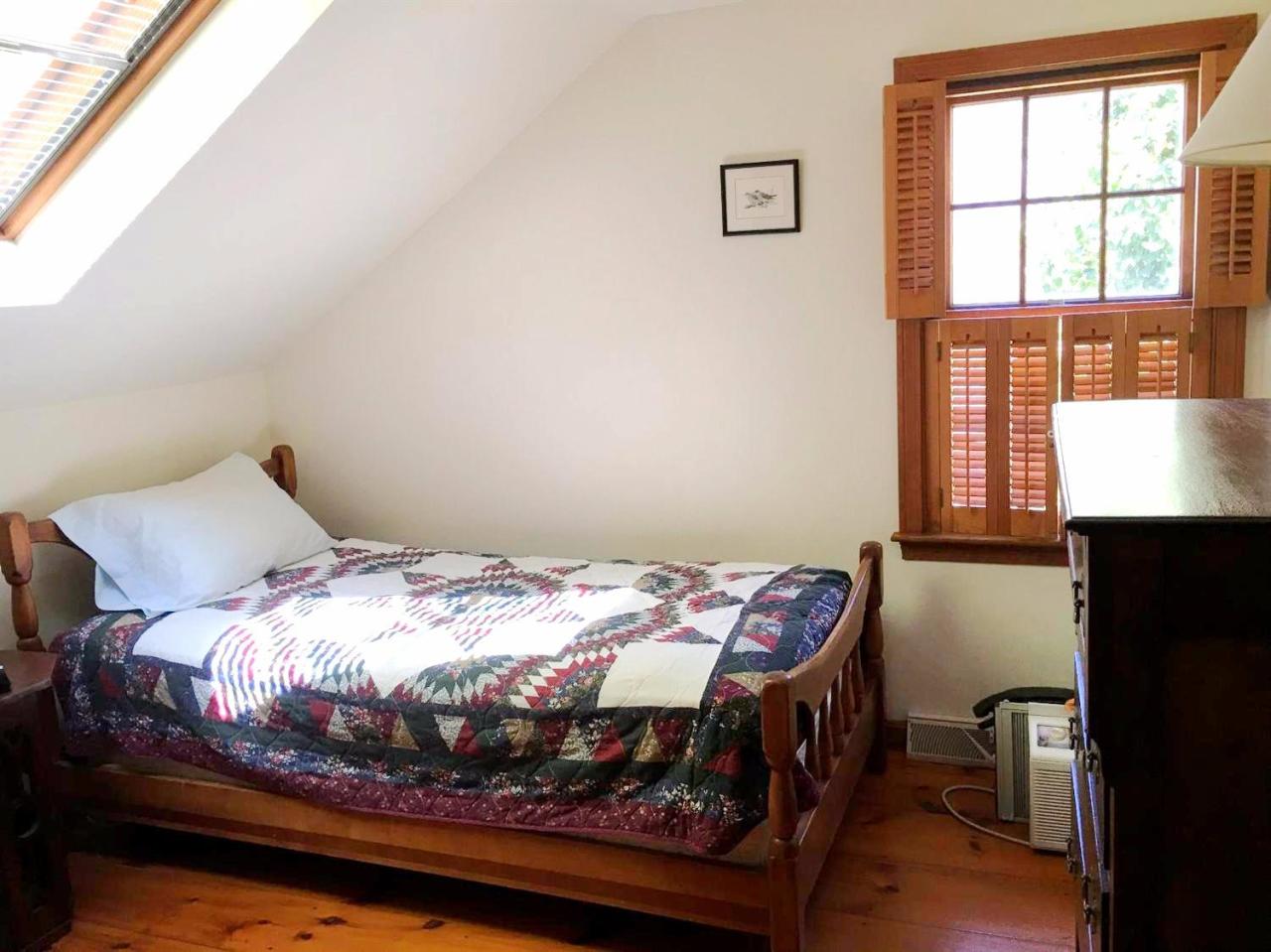 35 Split Rail Road Eastham, MA 02642 - Photo 25 of 28 a bedroom with a bed and a window