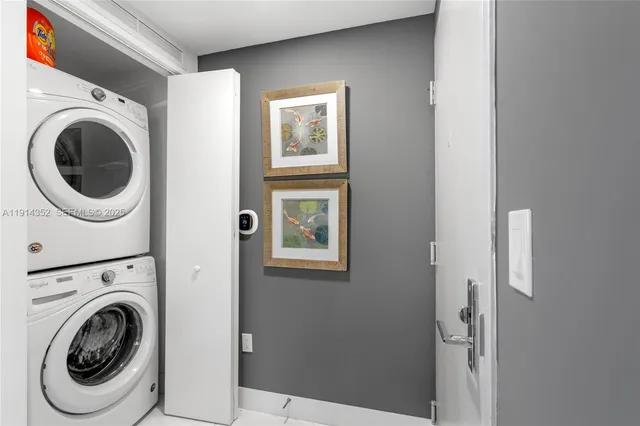 a view of a hallway with washer and dryer