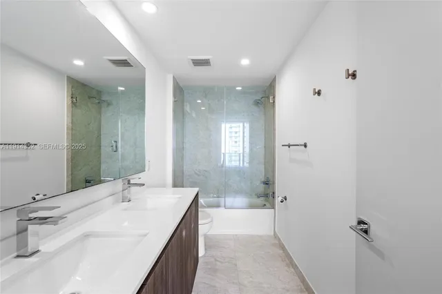 a bathroom with a shower and a bathtub