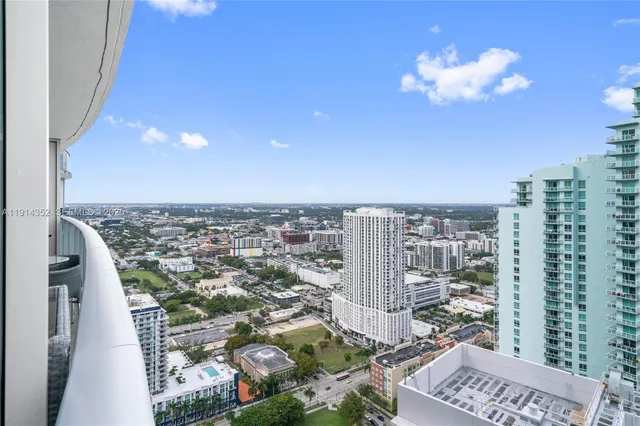 a view of living room with furniture and wooden floor