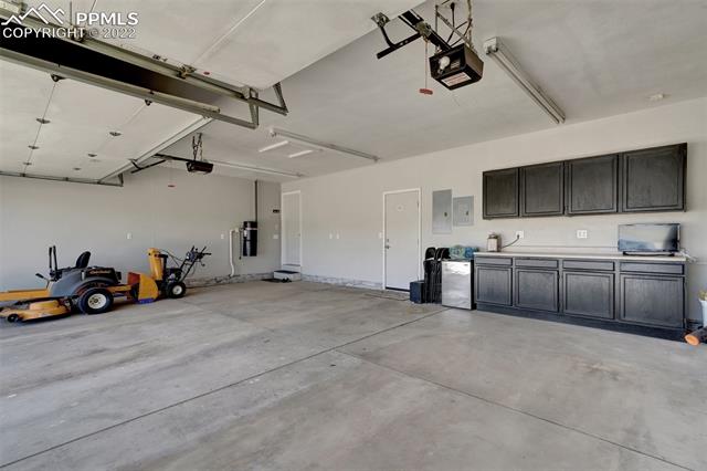 755 Struthers Loop Colorado Springs, CO 80921 - Photo 33 of 37 Large garage with cabinets