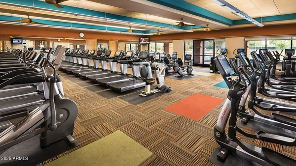 a view of a gym with wooden floor