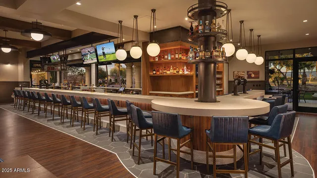 a large kitchen with a table and chairs
