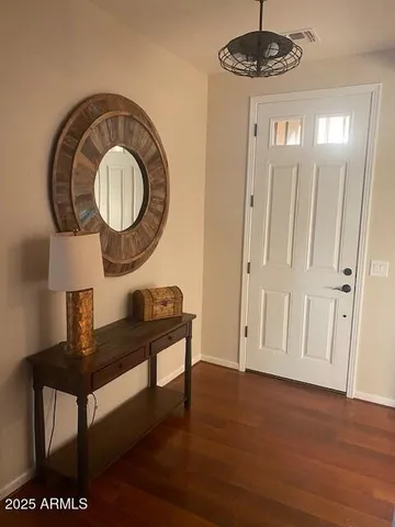 a view of a livingroom with furniture and wooden floor