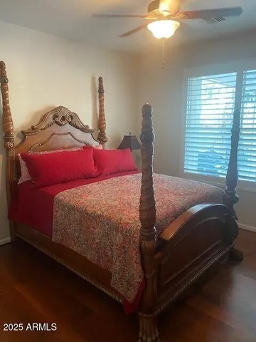 a bedroom with a bed and window