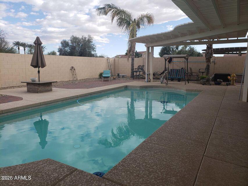 2029 North 164th Avenue Goodyear, AZ 85395 - Photo 8 of 17 a view of a swimming pool with a patio