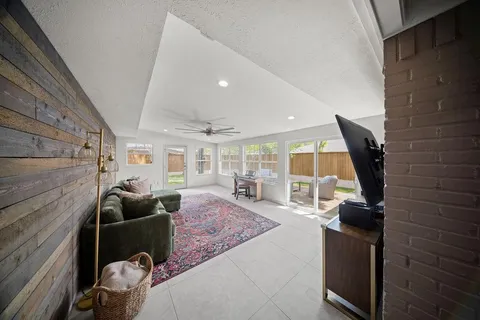 a large kitchen with kitchen island a sink stainless steel appliances and cabinets