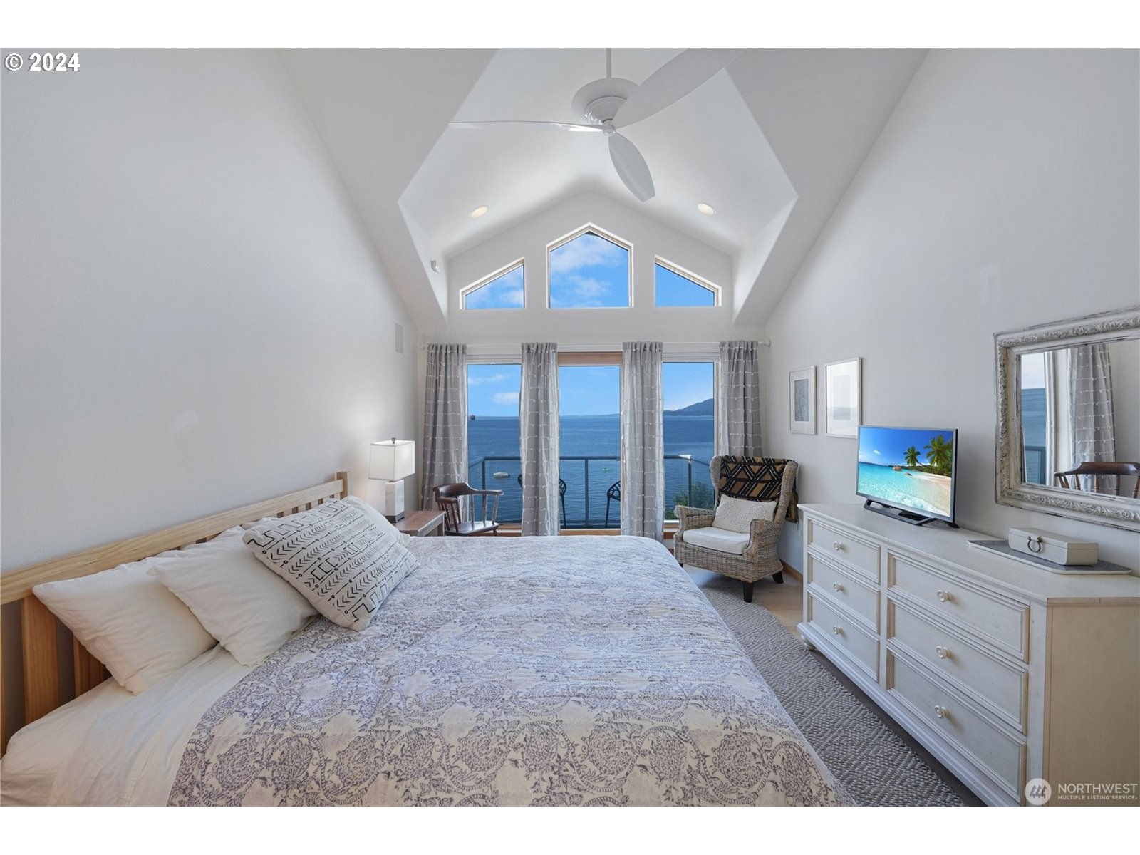 4844 G Loop Bow, WA 98232 - Photo 17 of 40 a bedroom with a large bed and a large window