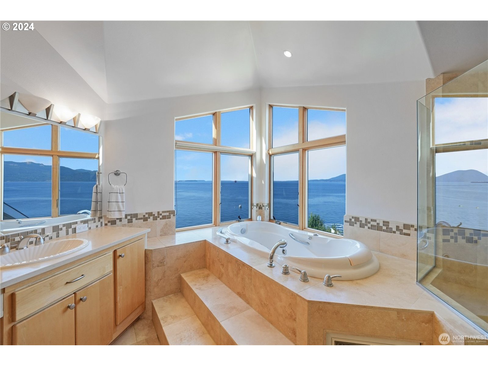 4844 G Loop Bow, WA 98232 - Photo 18 of 40 a bathroom with a tub sink and mirror