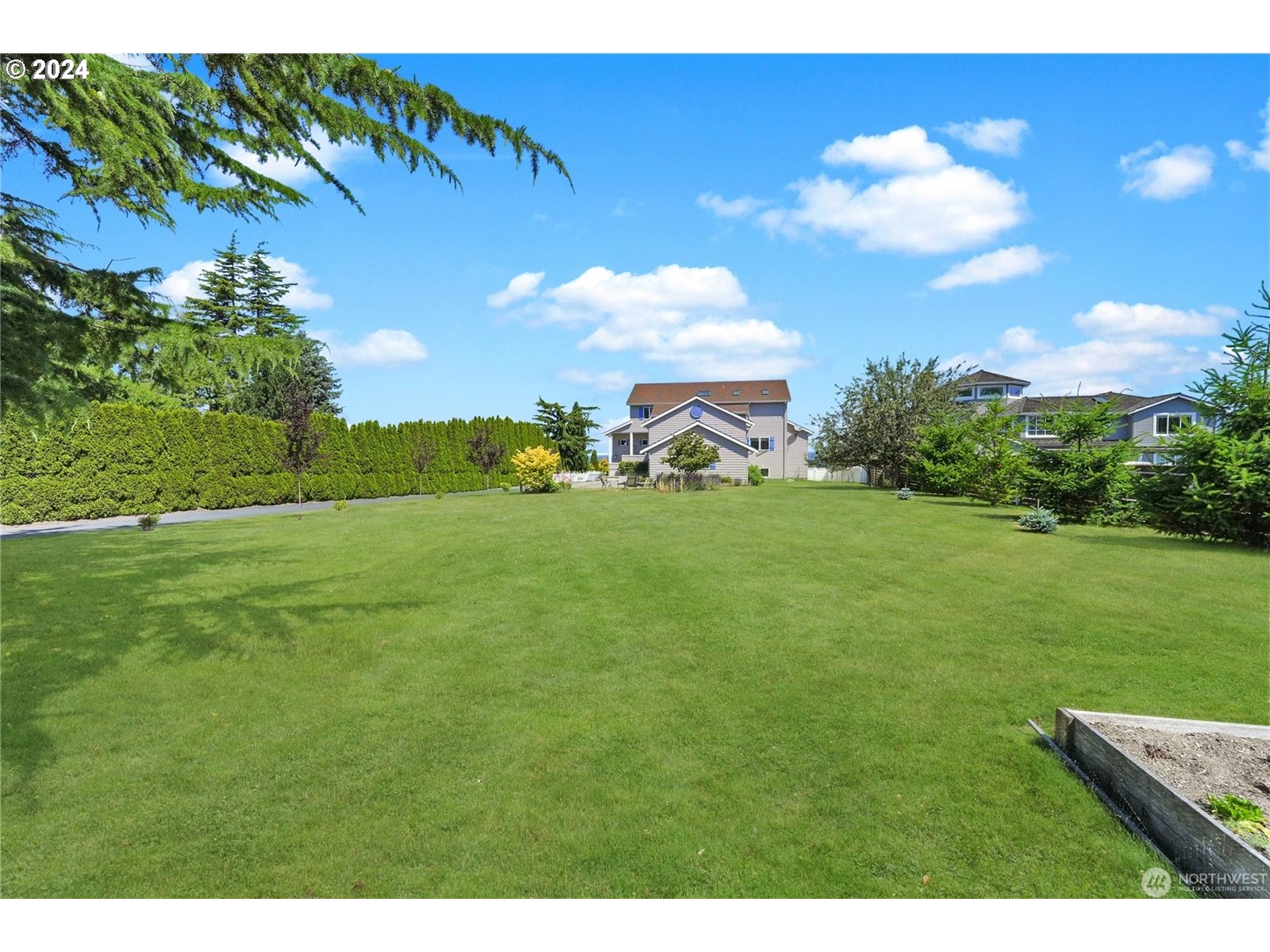 4844 G Loop Bow, WA 98232 - Photo 39 of 40 a backyard of a house with table and chairs